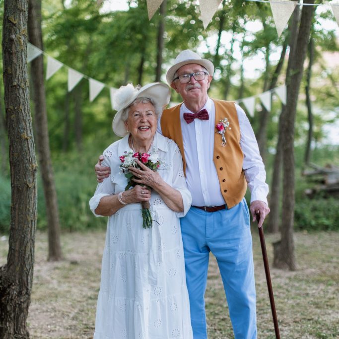 Senior couple having marriage in nature during a summer day.